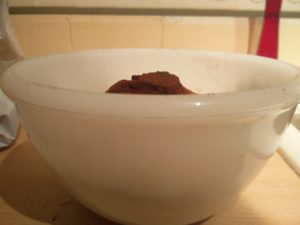 The pile of cocoa powder reaching the top of the mixing bowl