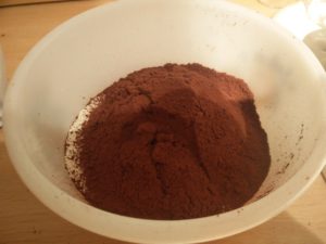 The cocoa powder and flour together in the mixing bowl