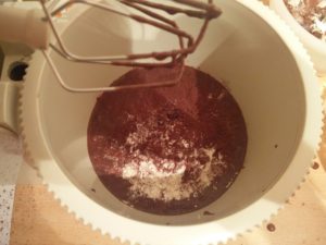 More mix ingredients being poured into the mixing bowl