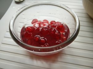 The cherries being washed in warm water