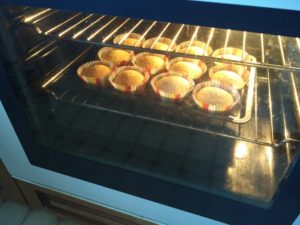 The cakes in the oven, having risen