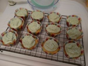 The icing has been spread around the cakes and spiked up