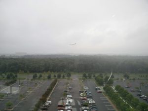 A plane coming in to land, looking eastward from the observation tower