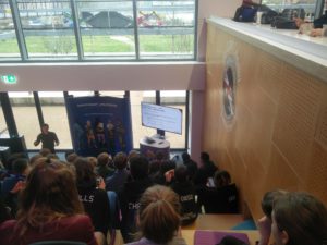 The presenter of the talk, with a tool to change HTTP status codes showing on the monitor